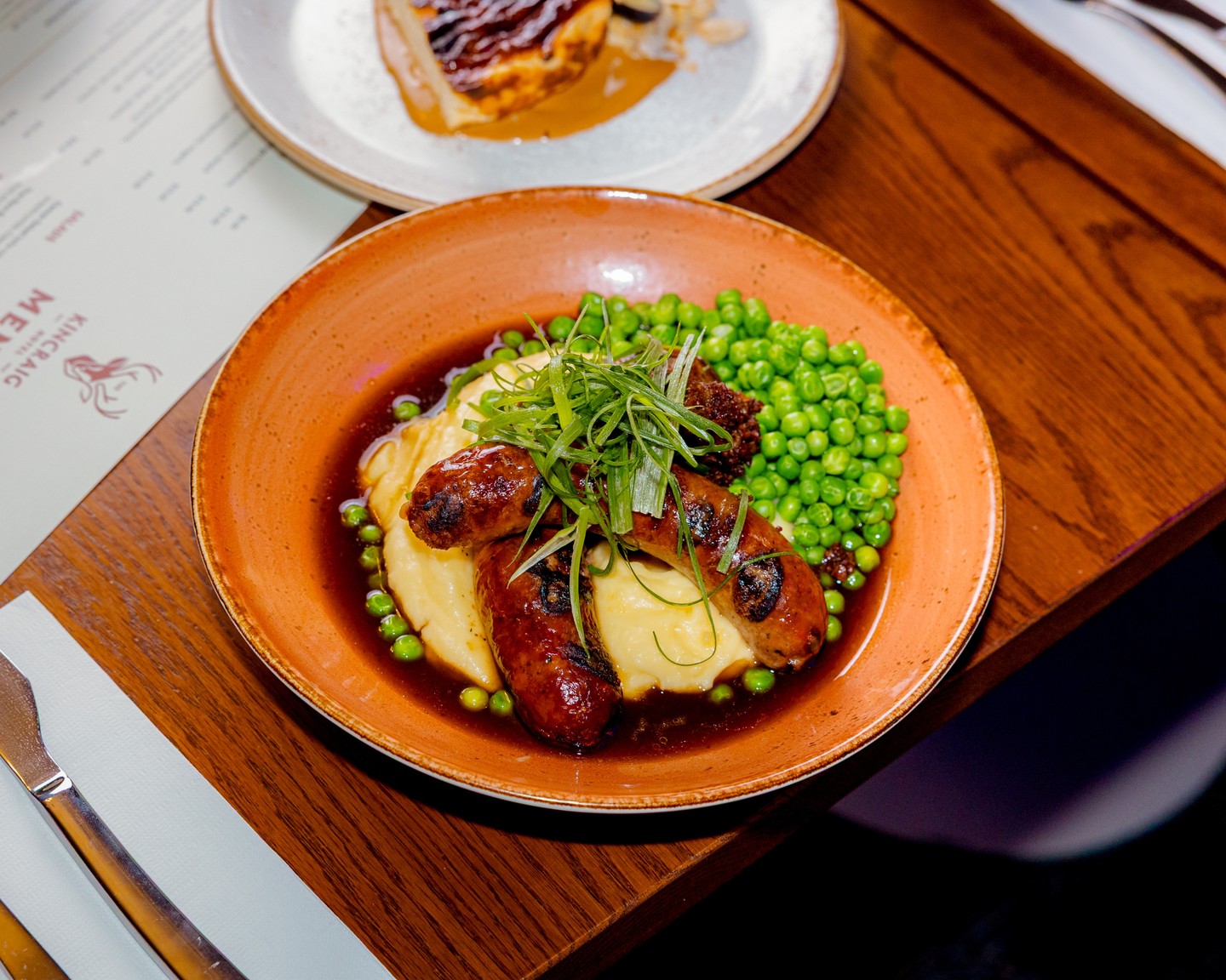 Tender Cuts made this sausage especially for us.

Our Bangers & Mash starts just down the road, with a speciality Kincraig sausage made locally by Tender Cuts.

Served with creamy mash, green peas, bacon jam and red wine jus, proper comfort food with a bit of Naracoorte behind it.